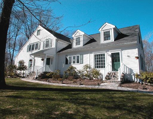 166 Keeler Drive Ridgefield, CT 06877 - Photo 1 of 1 a front view of a house with garden