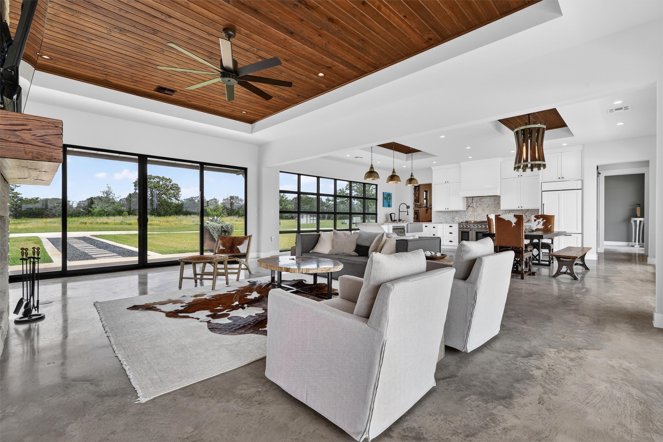 1629 Waldeck Road Ledbetter, TX 78946 - Photo 7 of 50 Living Room with view towards front entry. Tray ceilings with hardwood accents.