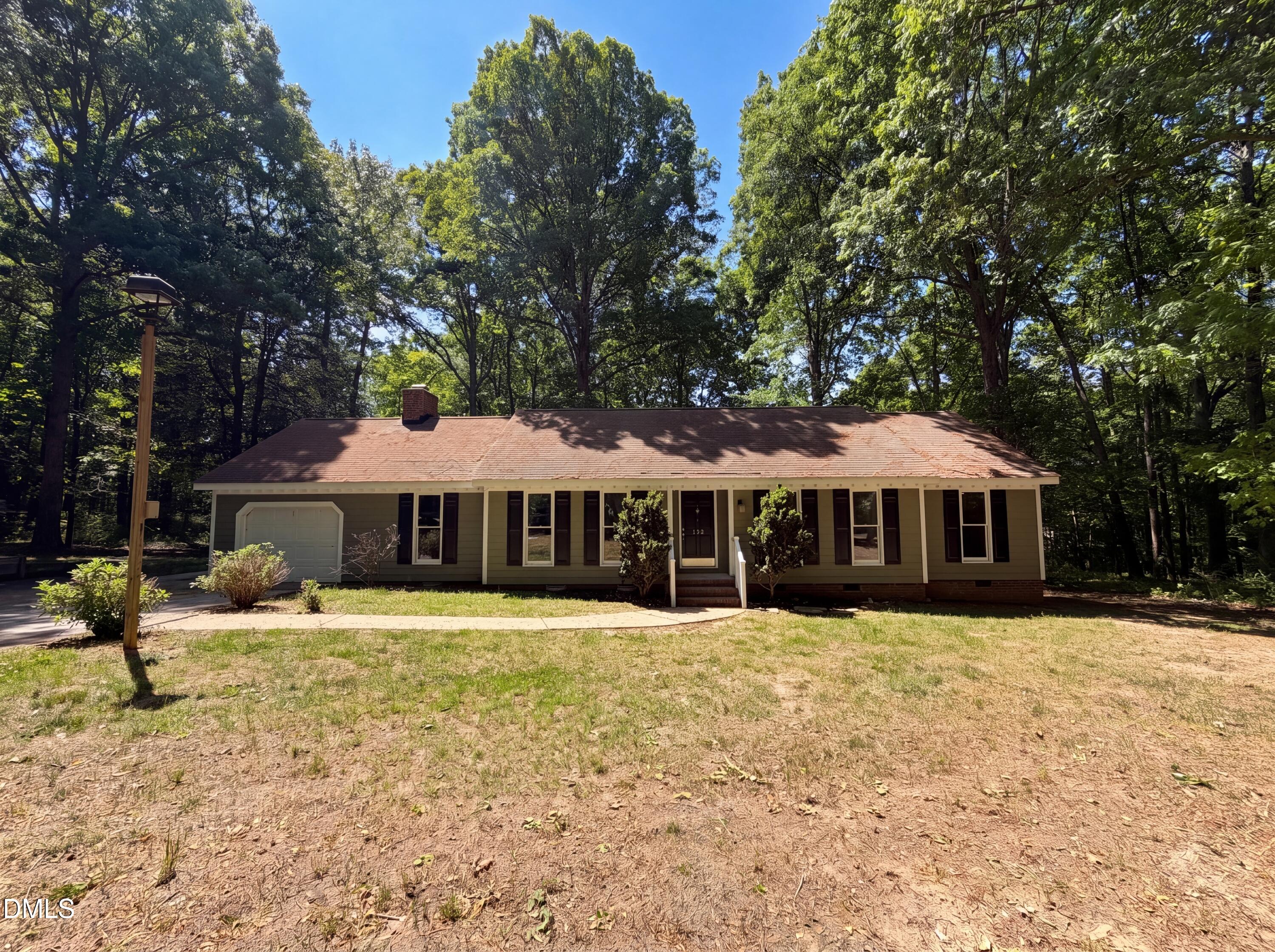 102 Lakeside Farm Road Zebulon, NC 27597 - Photo 1 of 18 a front view of a house with a yard