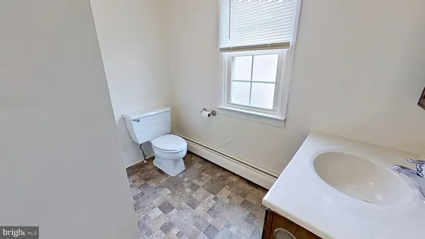 a bathroom with a sink and a toilet