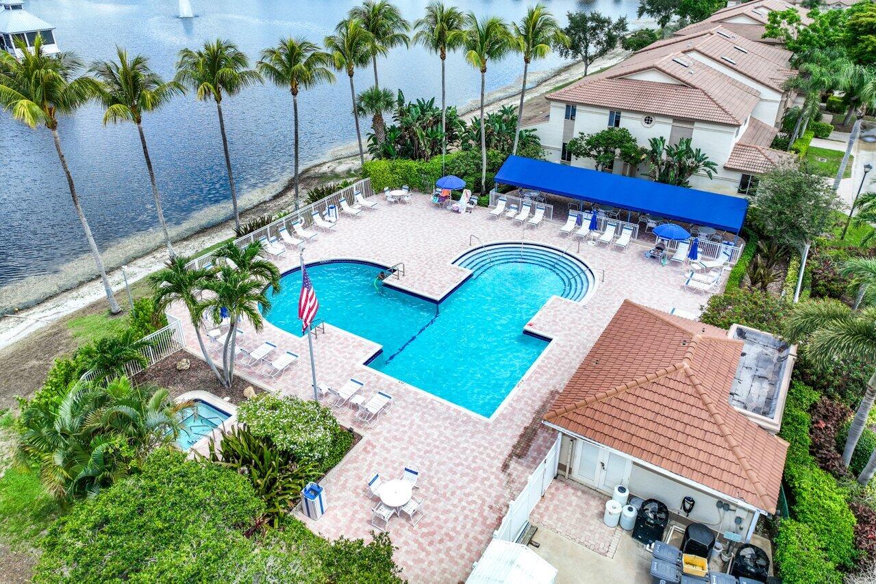 6684 Via Regina Boca Raton, FL 33433 - Photo 19 of 19 a view of a patio with table and chairs potted plants