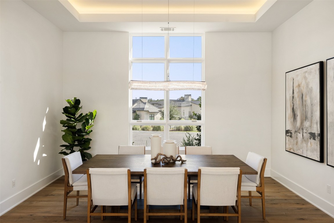 567 Delayne Drive Austin, TX 78737 - Photo 11 of 40 a dining room with furniture window and wooden floor