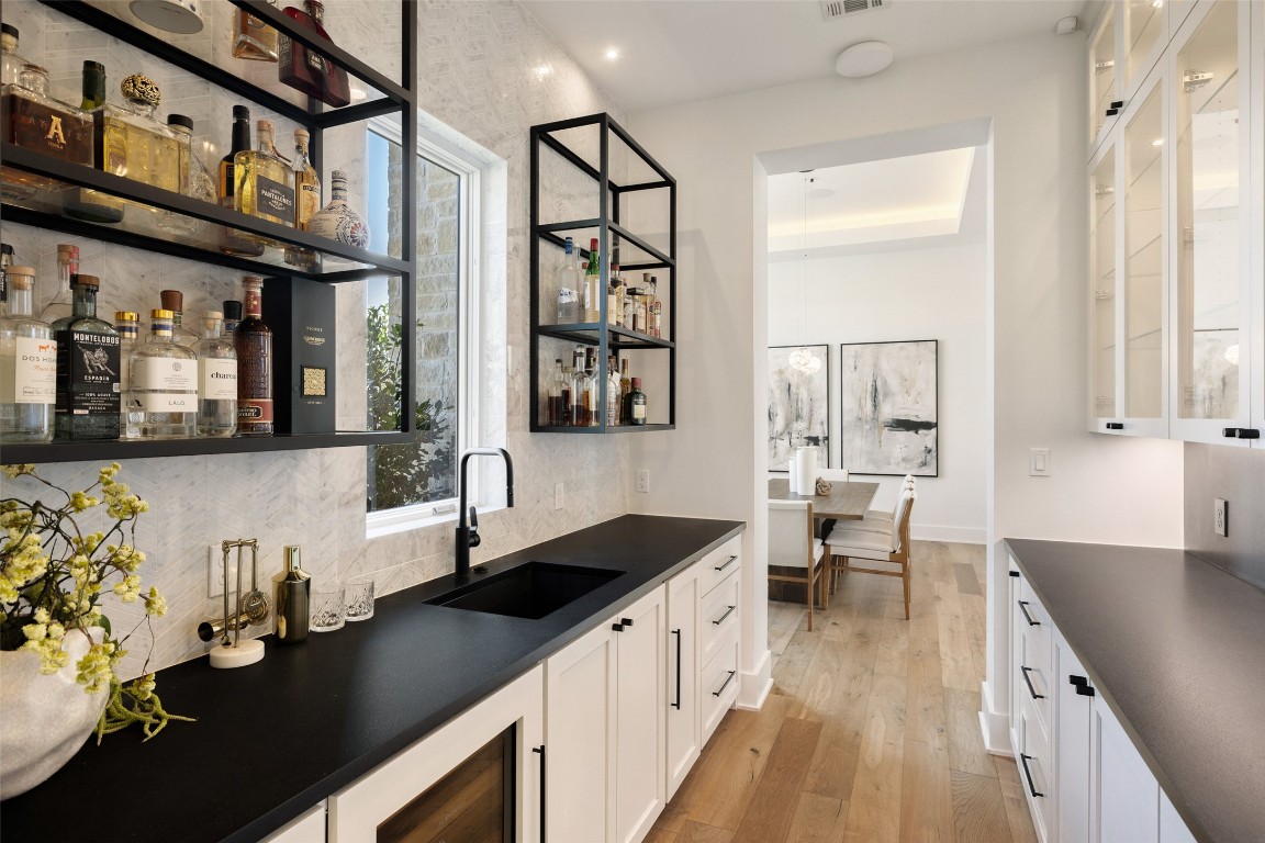 567 Delayne Drive Austin, TX 78737 - Photo 12 of 40 a kitchen with granite countertop a sink stove and cabinets