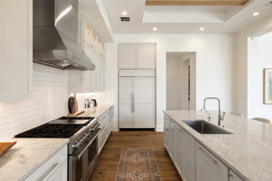 567 Delayne Drive Austin, TX 78737 - Photo 15 of 40 a kitchen with stainless steel appliances granite countertop a sink stove and refrigerator