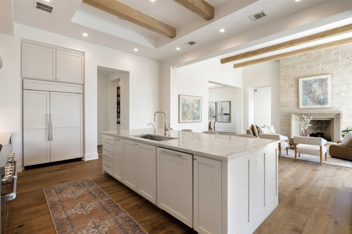 567 Delayne Drive Austin, TX 78737 - Photo 16 of 40 a spacious bathroom with a granite countertop sink a mirror and a vanity