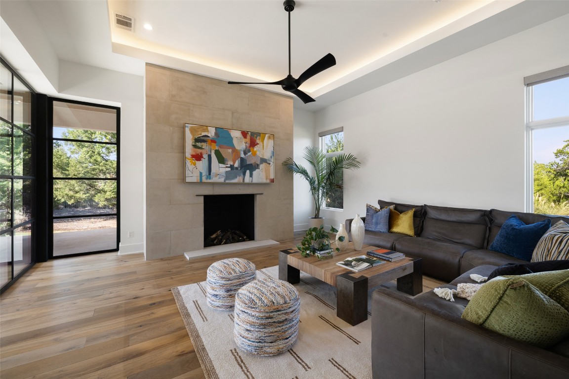 567 Delayne Drive Austin, TX 78737 - Photo 18 of 40 a living room with furniture and a fireplace