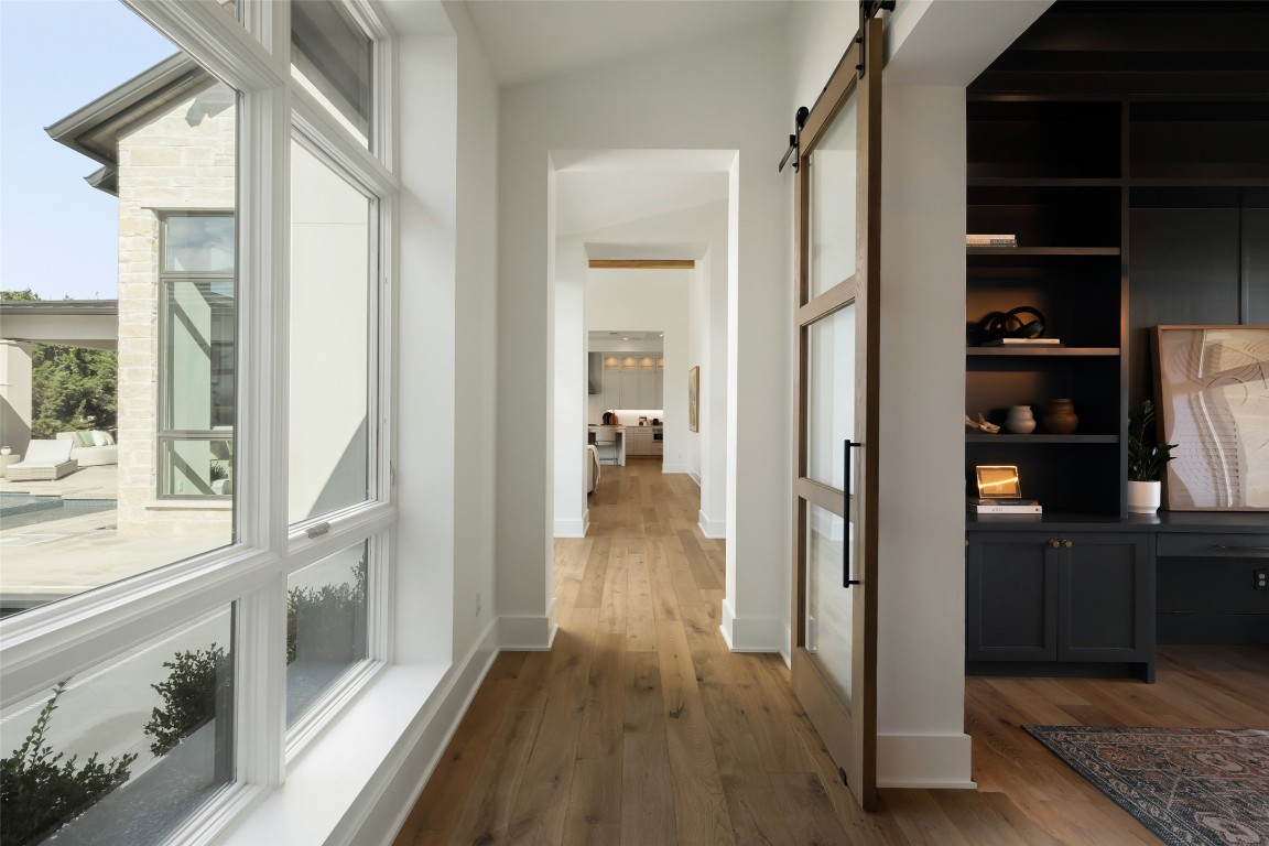 567 Delayne Drive Austin, TX 78737 - Photo 20 of 40 a view of hallway with wooden floor and furniture