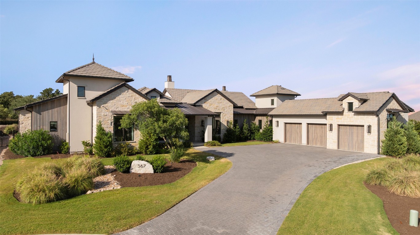 567 Delayne Drive Austin, TX 78737 - Photo 2 of 40 a front view of a house with a yard and potted plants