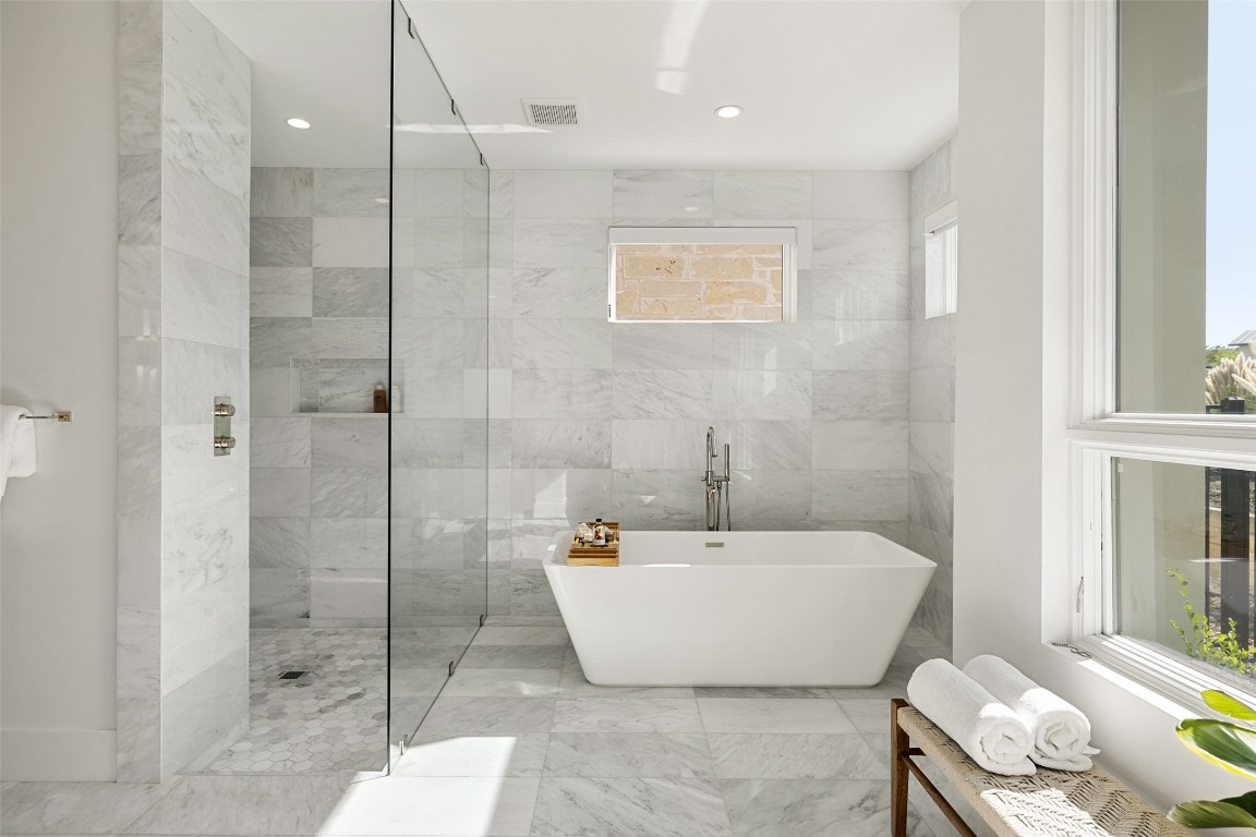 567 Delayne Drive Austin, TX 78737 - Photo 24 of 40 a bathroom with a bathtub and shower