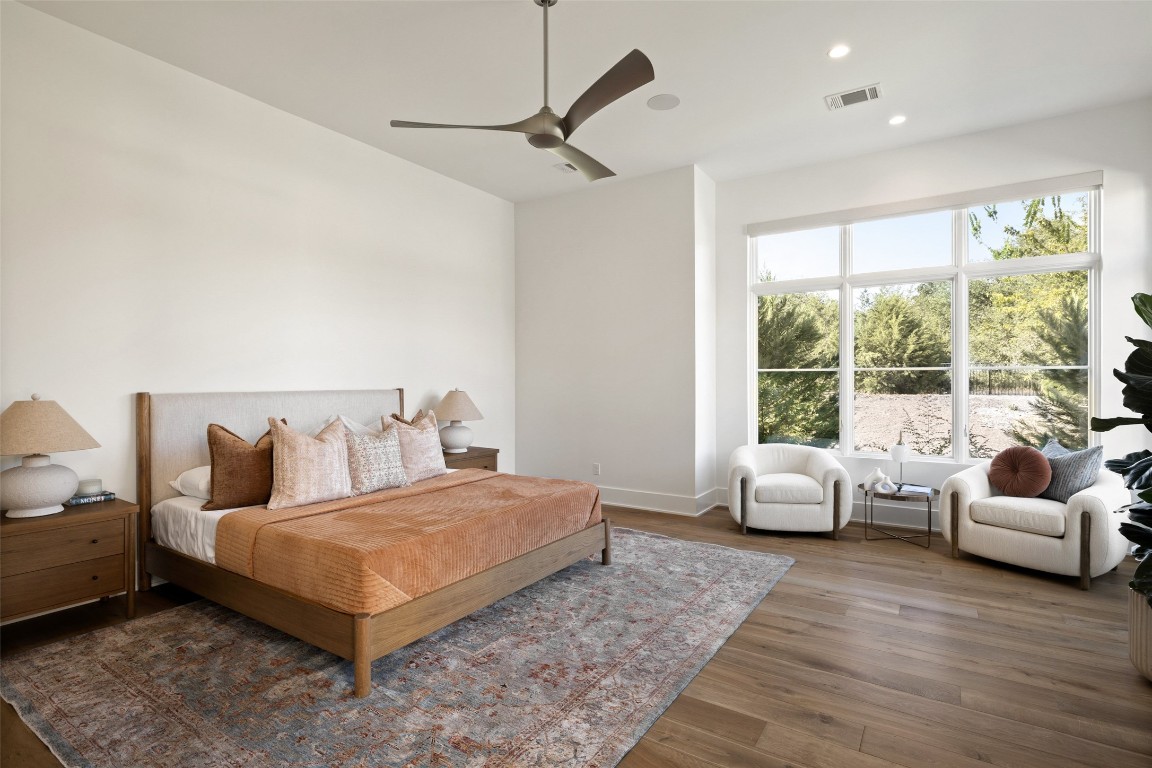 567 Delayne Drive Austin, TX 78737 - Photo 26 of 40 a bedroom with a bed and a couch