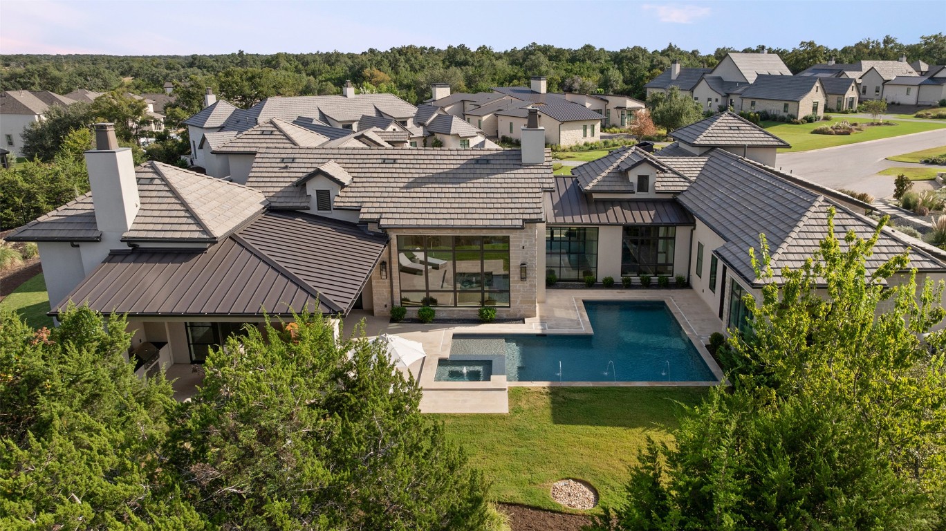 567 Delayne Drive Austin, TX 78737 - Photo 3 of 40 a aerial view of a house with swimming pool and a yard