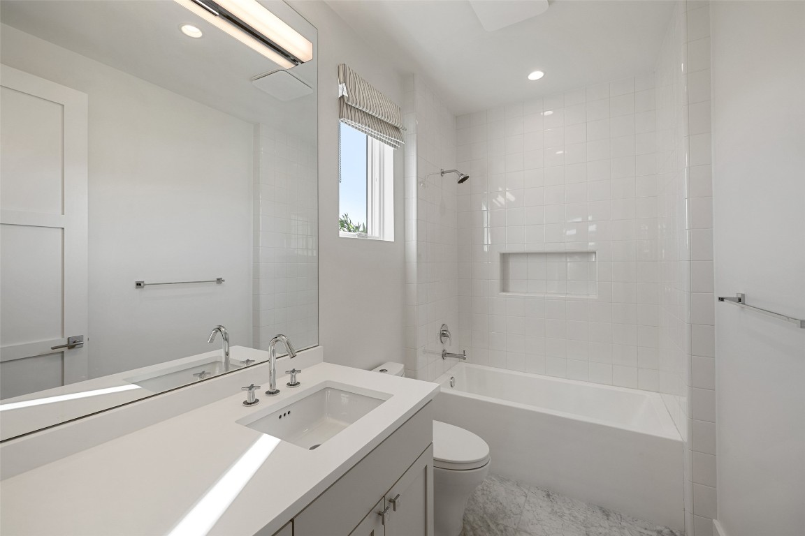 567 Delayne Drive Austin, TX 78737 - Photo 32 of 40 a bathroom with a sink a toilet and shower