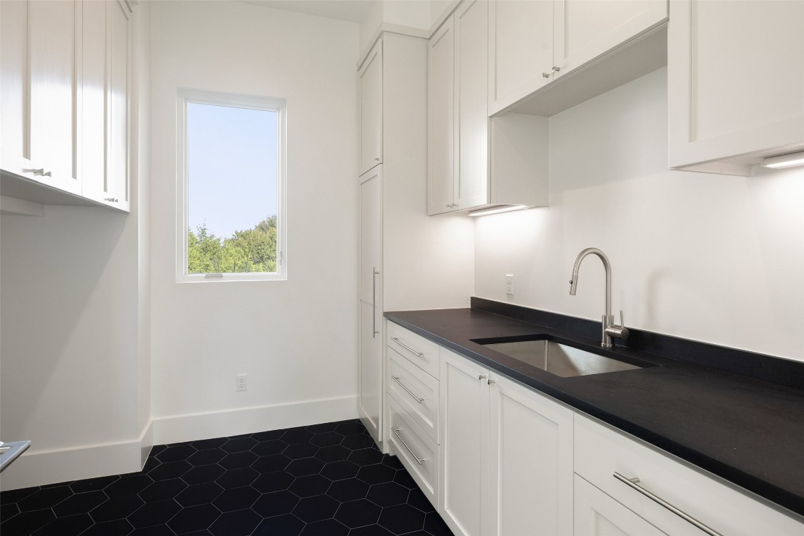 567 Delayne Drive Austin, TX 78737 - Photo 34 of 40 a close view of a sink a counter space and cabinets