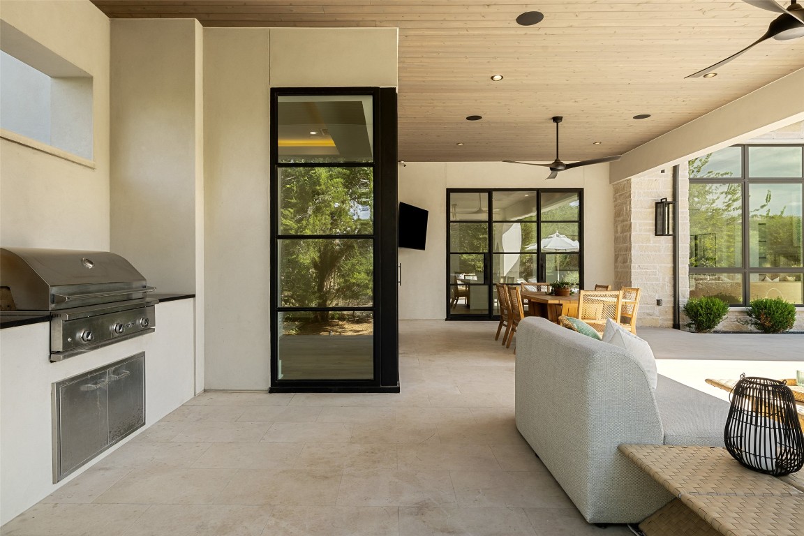 567 Delayne Drive Austin, TX 78737 - Photo 35 of 40 a living room with furniture and a fireplace