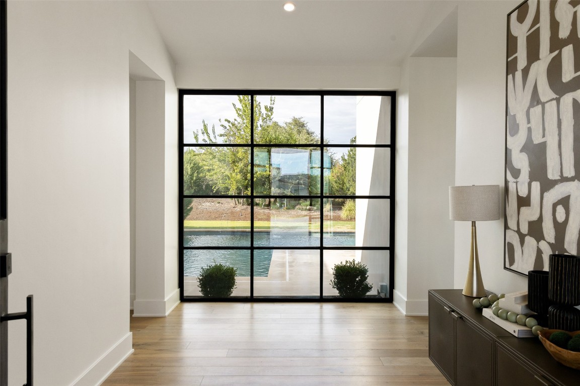 567 Delayne Drive Austin, TX 78737 - Photo 4 of 40 a view of a room with wooden floor and windows