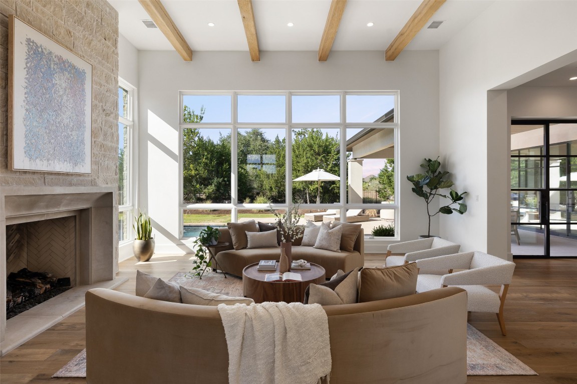 567 Delayne Drive Austin, TX 78737 - Photo 6 of 40 a living room with fireplace furniture and a large window