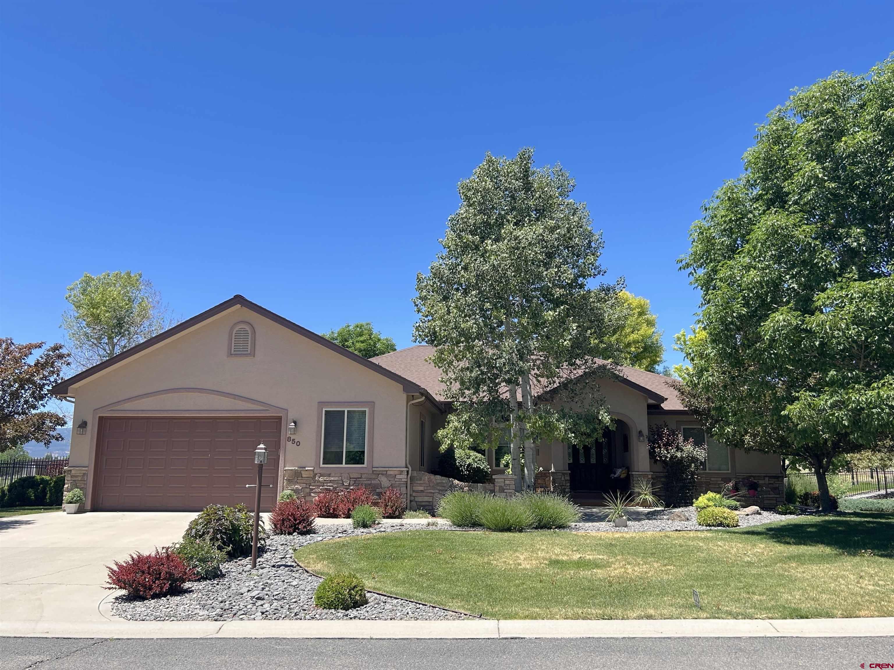 850 Southeast Pinyon Street Cedaredge, CO 81413 - Photo 1 of 45 a front view of a house with a yard