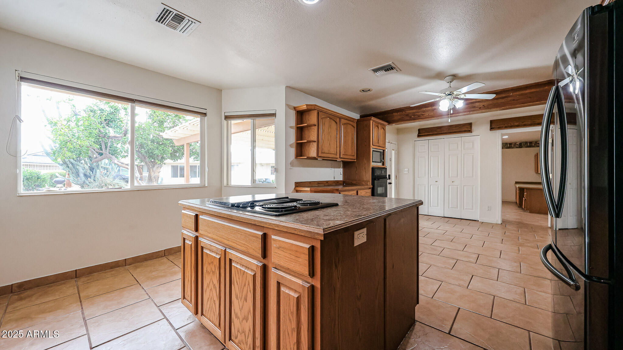 11851 North Thunderbird Road Sun City, AZ 85351 - Photo 12 of 46 a kitchen with a stove and a refrigerator