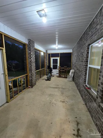 a view of a livingroom with furniture and a flat screen tv