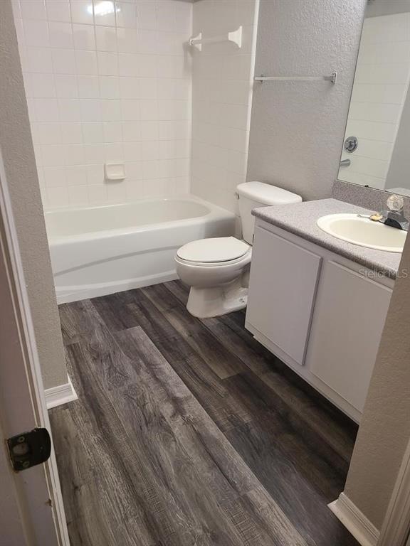 8933 Manor Loop, Unit 202 Lakewood Ranch, FL 34202 - Photo 5 of 17 a bathroom with a sink and a toilet