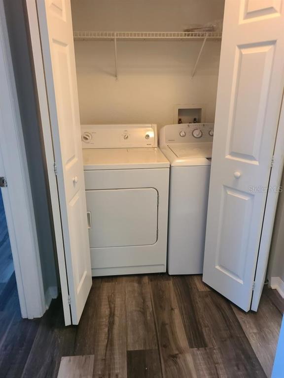 8933 Manor Loop, Unit 202 Lakewood Ranch, FL 34202 - Photo 6 of 17 a utility room with dryer and washer