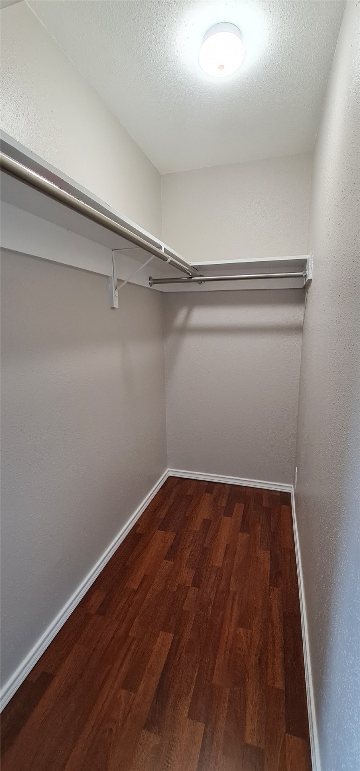 2201 Fountain View Drive, Unit 24 Houston, TX 77057 - Photo 8 of 9 a view of a room with wooden floor