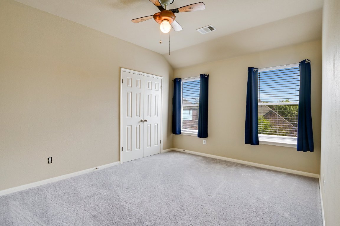 11705 Gold Run Cove Manor, TX 78653 - Photo 14 of 20 a view of an empty room with a window