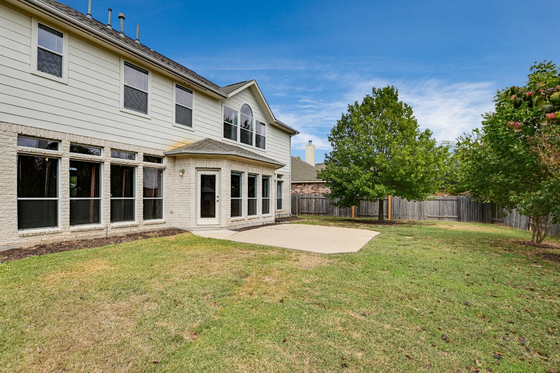 11705 Gold Run Cove Manor, TX 78653 - Photo 19 of 20 a front view of a house with a yard