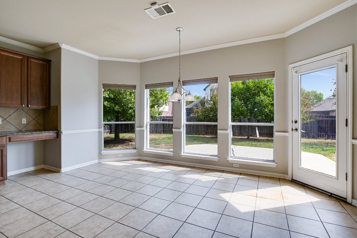 11705 Gold Run Cove Manor, TX 78653 - Photo 7 of 20 a view of an empty room with a window