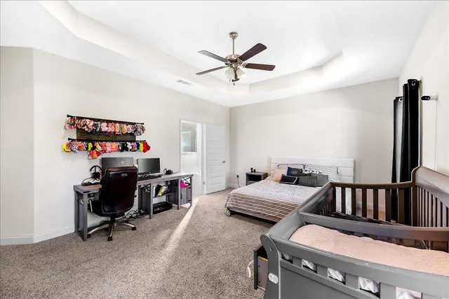 a bedroom with furniture and a window