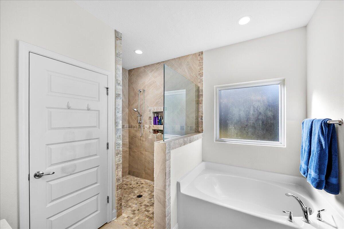 3030 Crown Creek Circle Crestview, FL 32539 - Photo 20 of 35 a bathroom with a bathtub and a shower