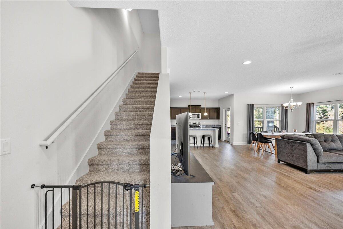 3030 Crown Creek Circle Crestview, FL 32539 - Photo 23 of 35 a living room with furniture and wooden floor