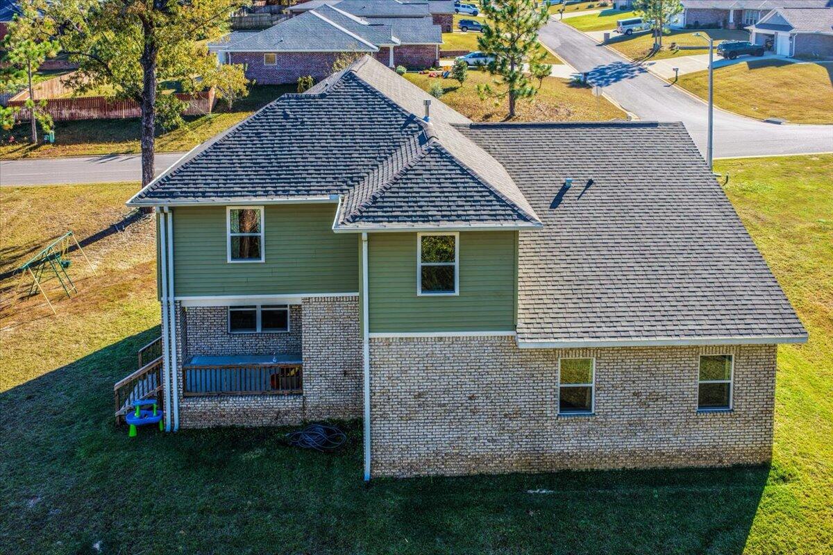 3030 Crown Creek Circle Crestview, FL 32539 - Photo 33 of 35 a front view of a house with a garden and yard
