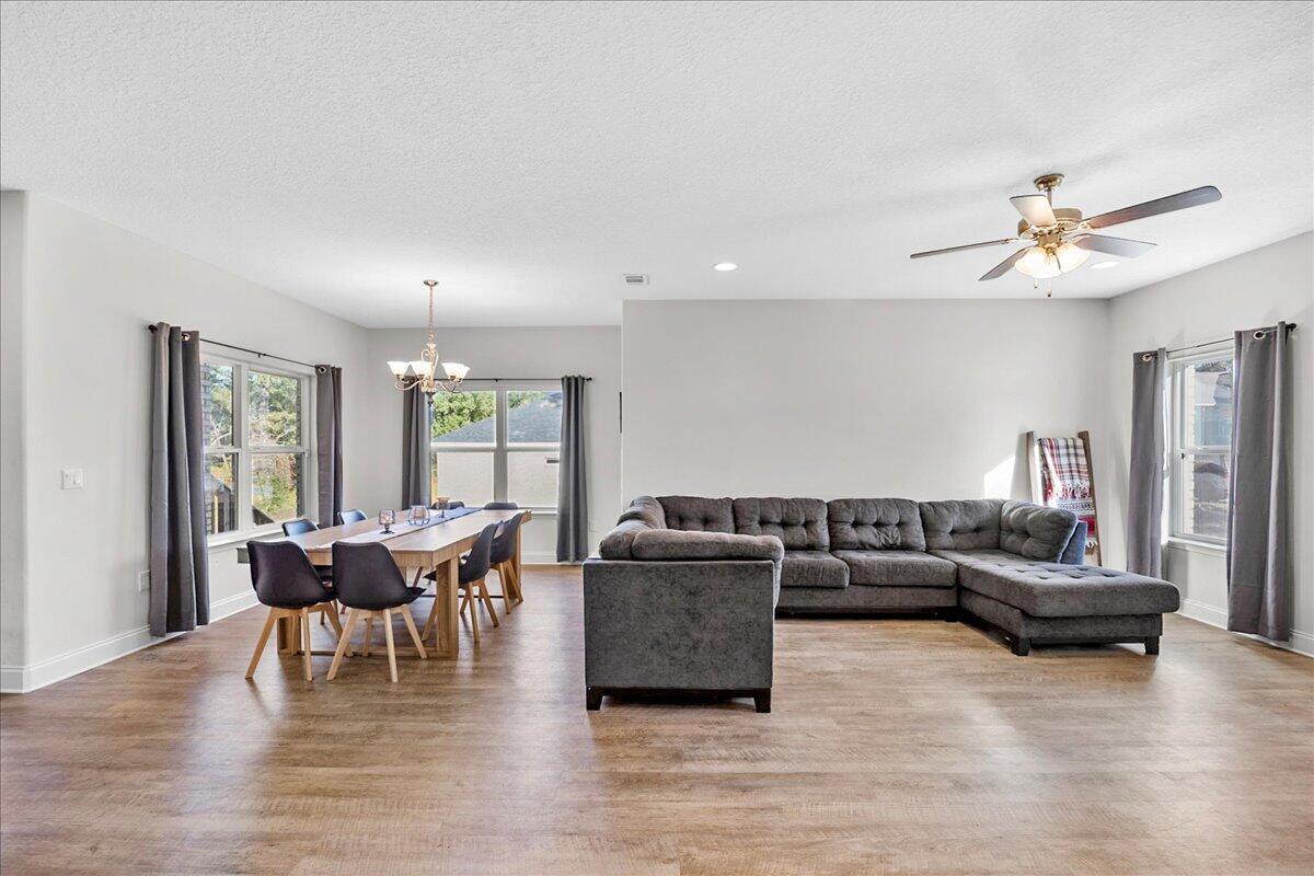 3030 Crown Creek Circle Crestview, FL 32539 - Photo 7 of 35 a living room with furniture and wooden floor