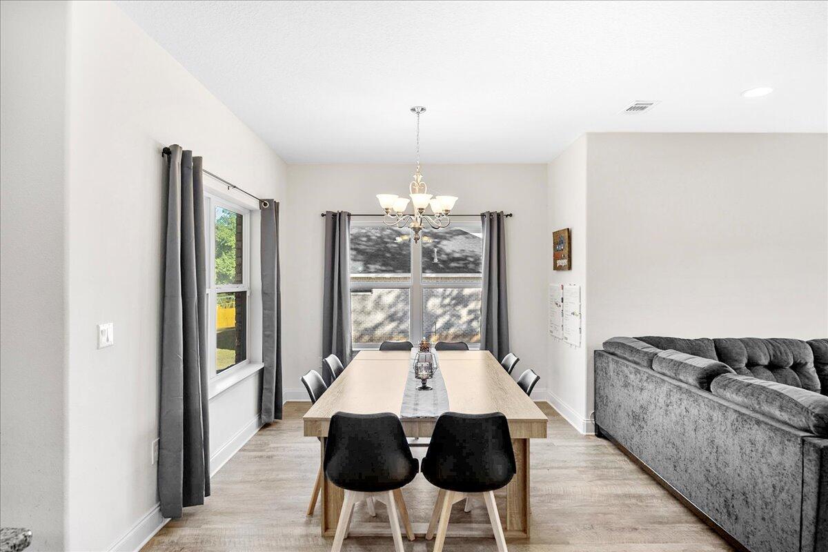 3030 Crown Creek Circle Crestview, FL 32539 - Photo 9 of 35 a dining room with furniture and window