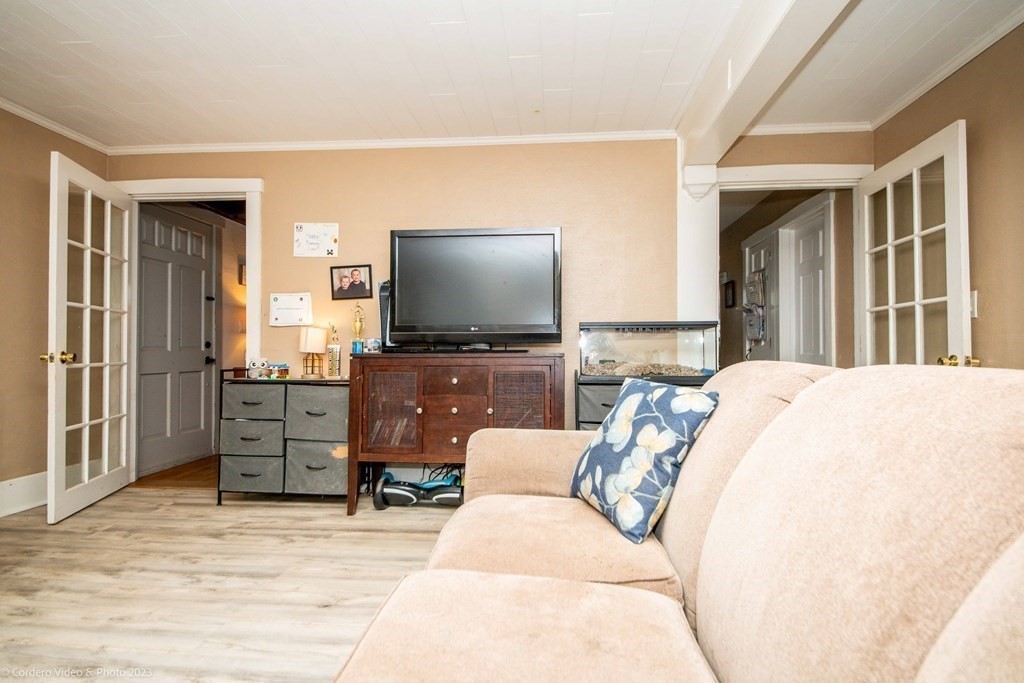 210 Hathaway Road Acushnet, MA 02743 - Photo 13 of 34 a living room with furniture and a flat screen tv
