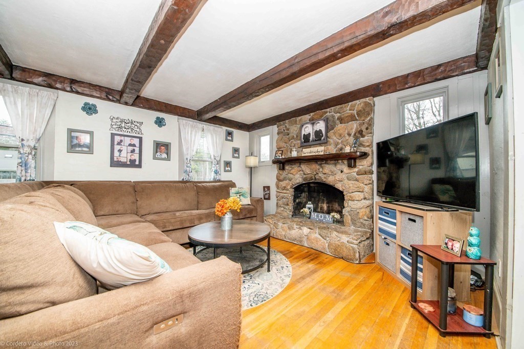 210 Hathaway Road Acushnet, MA 02743 - Photo 2 of 34 a living room with furniture and a flat screen tv