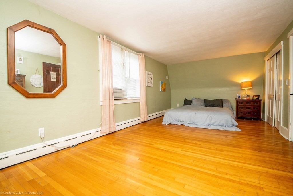 210 Hathaway Road Acushnet, MA 02743 - Photo 23 of 34 a bedroom with a bed and a mirror