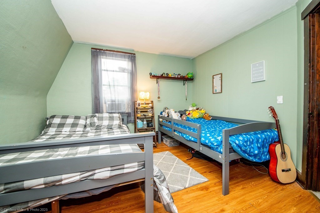 210 Hathaway Road Acushnet, MA 02743 - Photo 25 of 34 a bedroom with furniture and a wooden floor