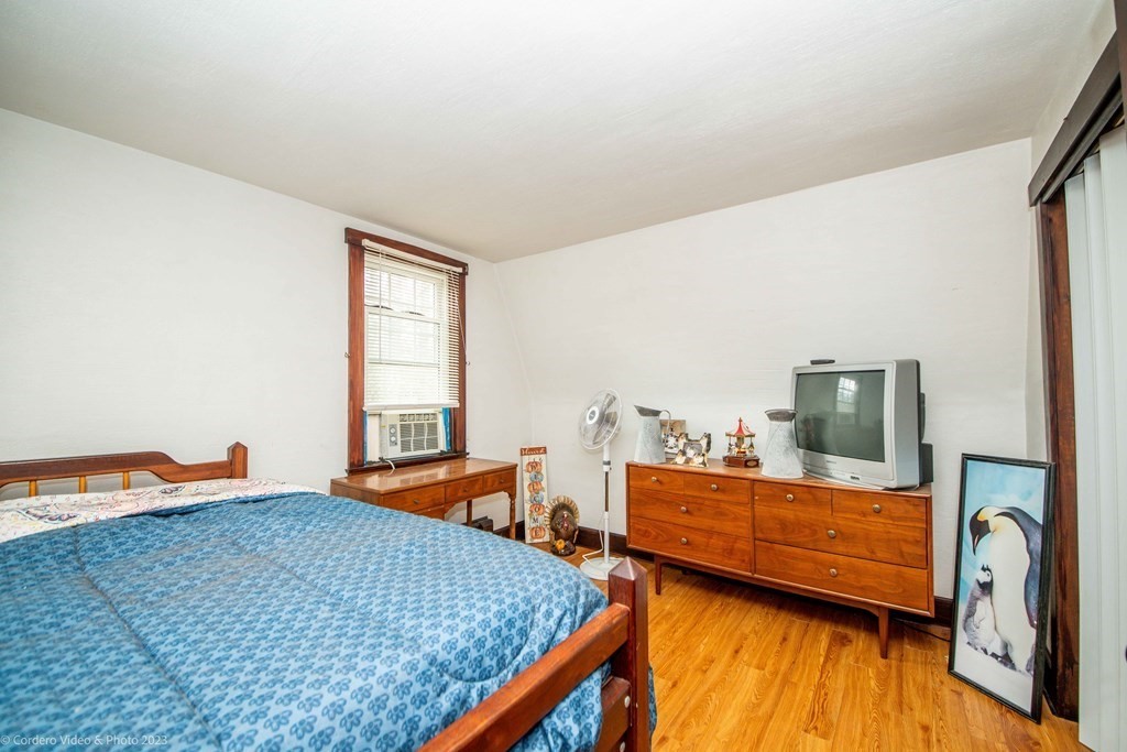 210 Hathaway Road Acushnet, MA 02743 - Photo 26 of 34 a bedroom with two beds and wooden floor