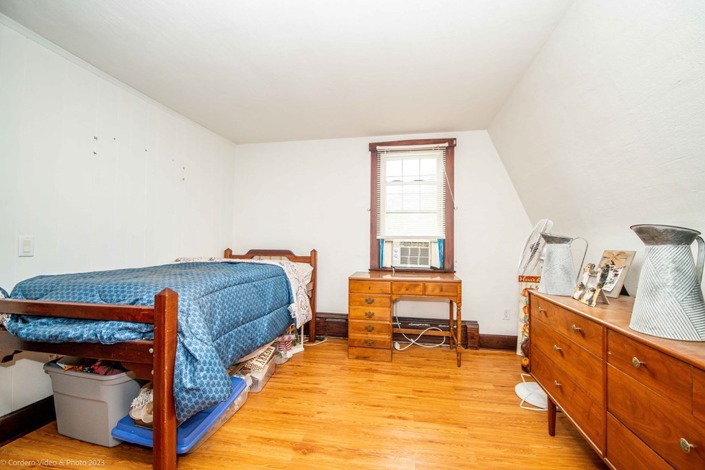 210 Hathaway Road Acushnet, MA 02743 - Photo 27 of 34 a bedroom with a bed and a desk