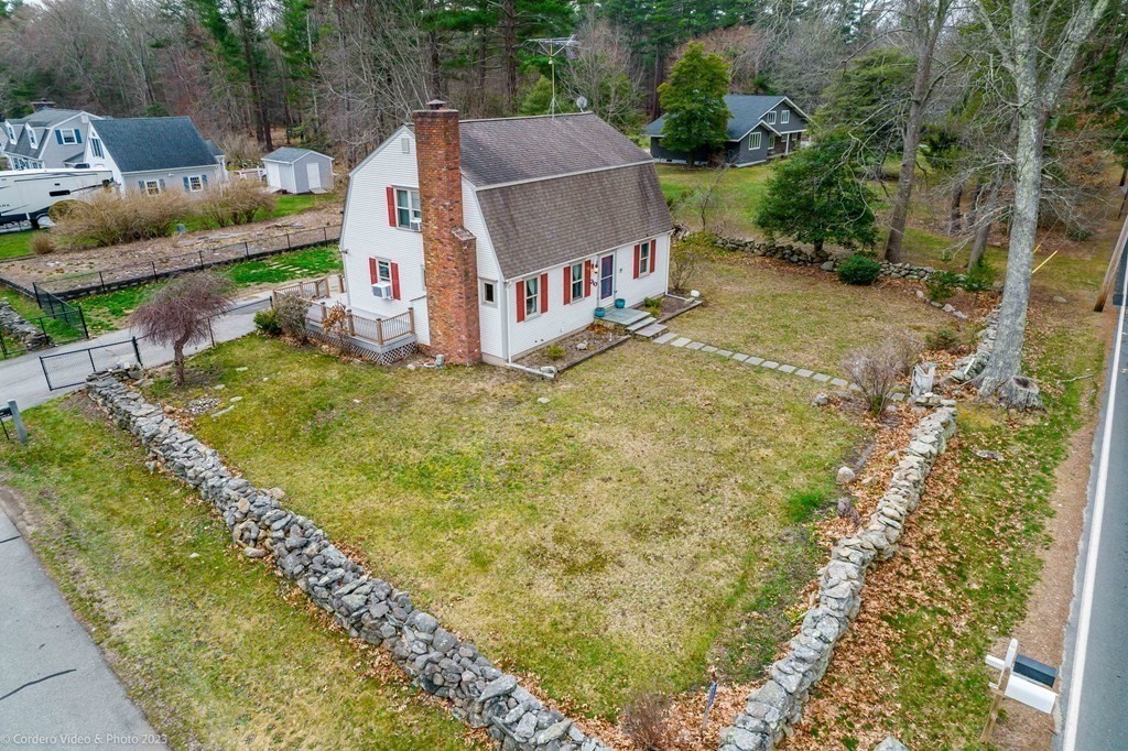 210 Hathaway Road Acushnet, MA 02743 - Photo 31 of 34 a view of a house with a yard and sitting area