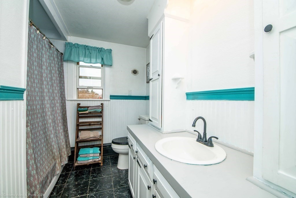 210 Hathaway Road Acushnet, MA 02743 - Photo 10 of 34 a bathroom with a sink and a mirror