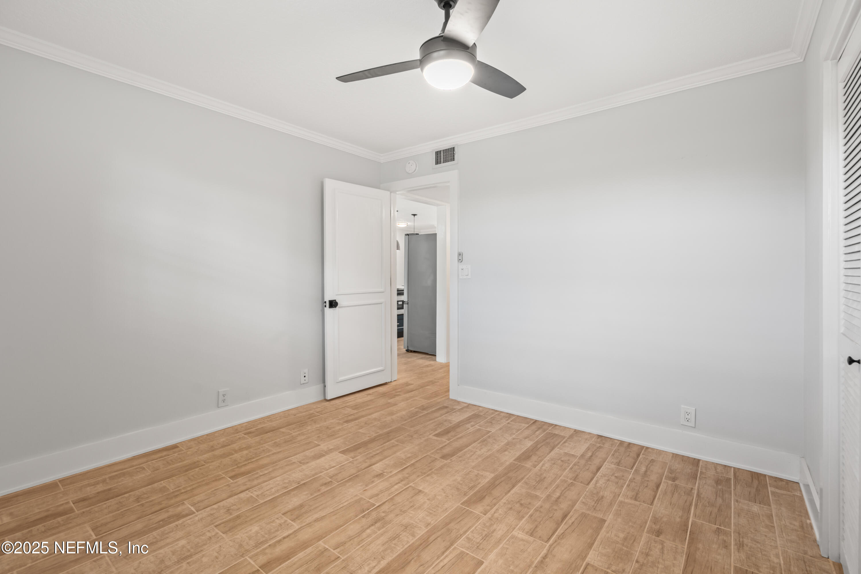 22 Comares Avenue, Unit 4A St. Augustine, FL 32080 - Photo 17 of 36 wooden floor in an empty room