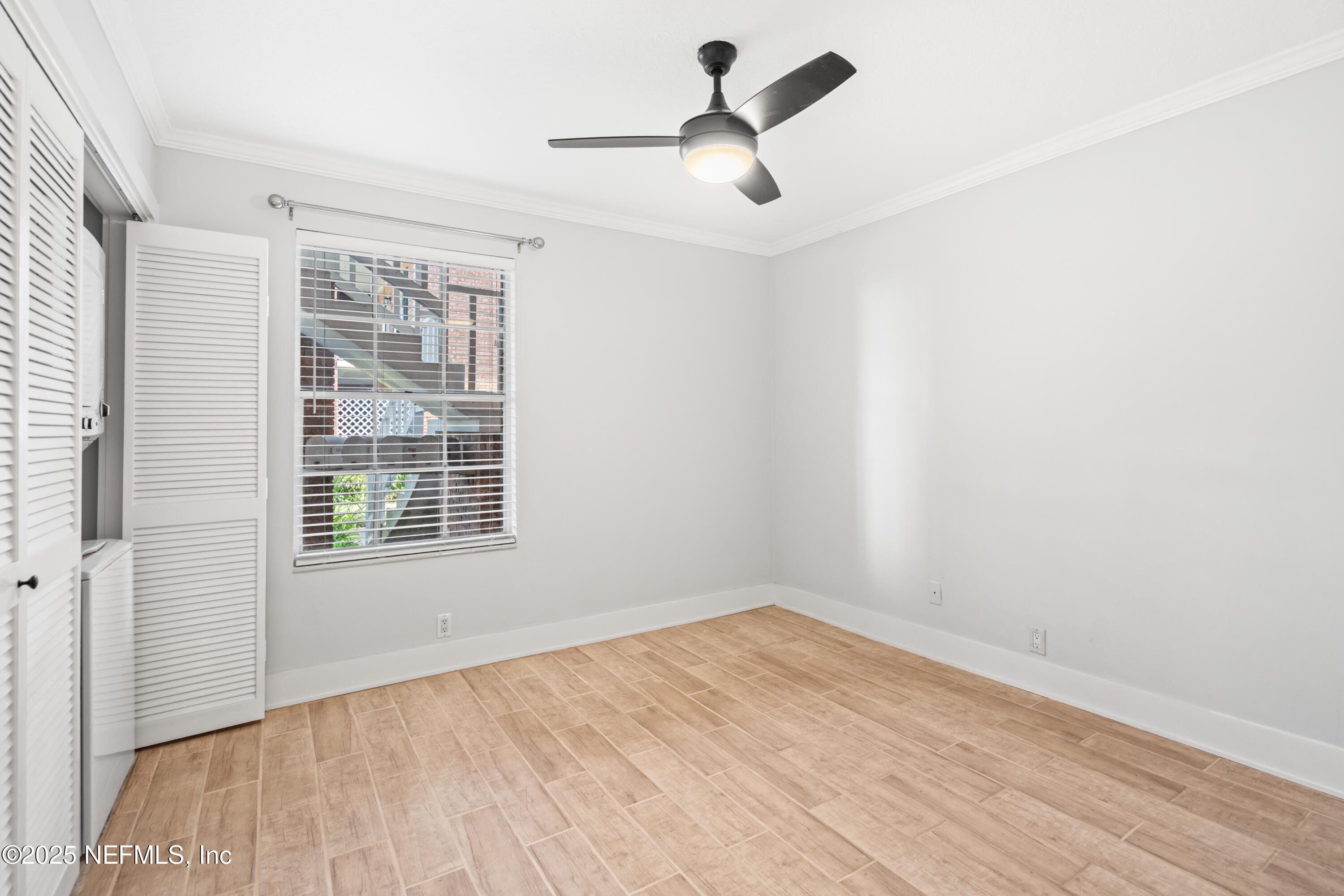 22 Comares Avenue, Unit 4A St. Augustine, FL 32080 - Photo 18 of 36 a view of empty room with a window