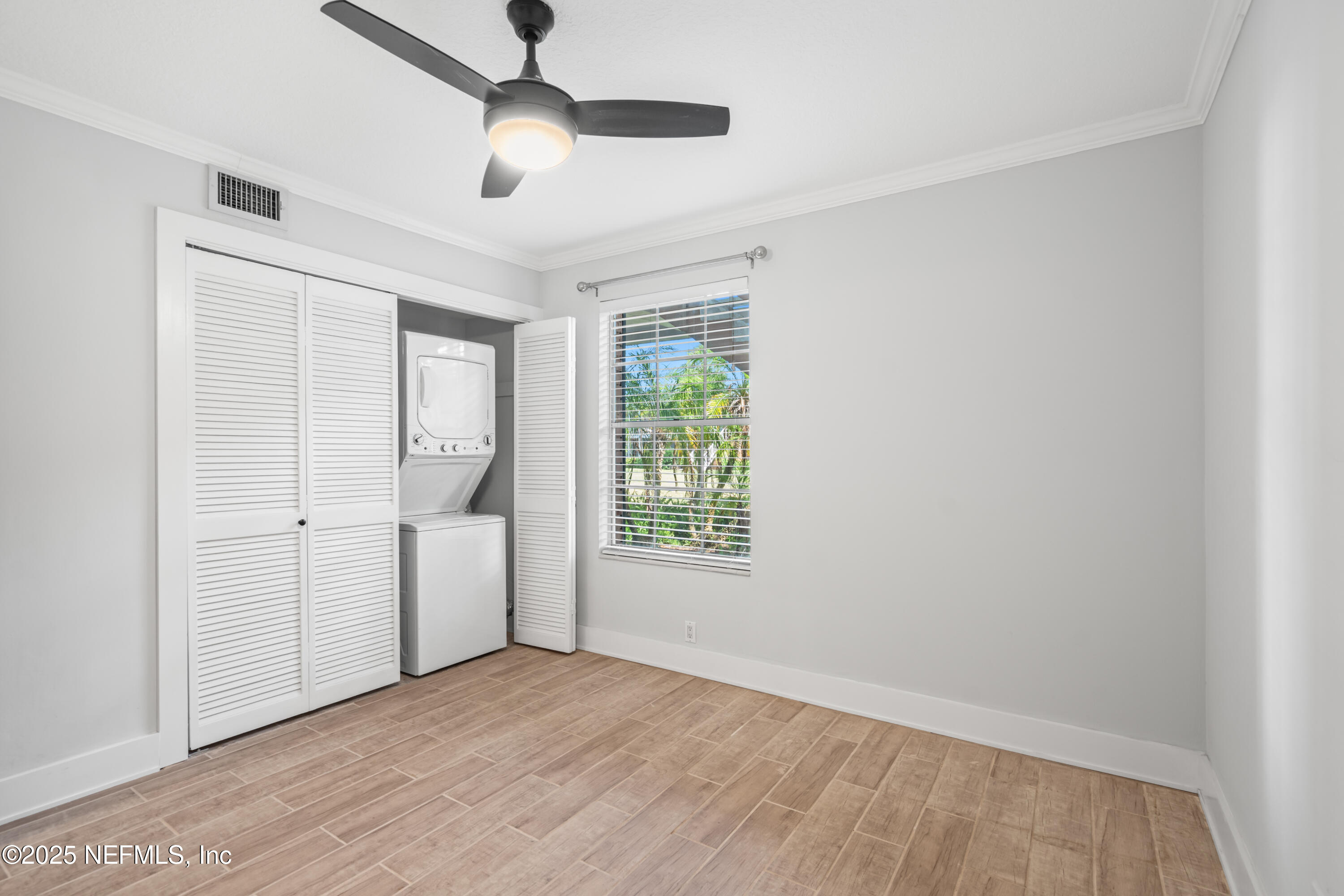 22 Comares Avenue, Unit 4A St. Augustine, FL 32080 - Photo 19 of 36 a view of an empty room with a window