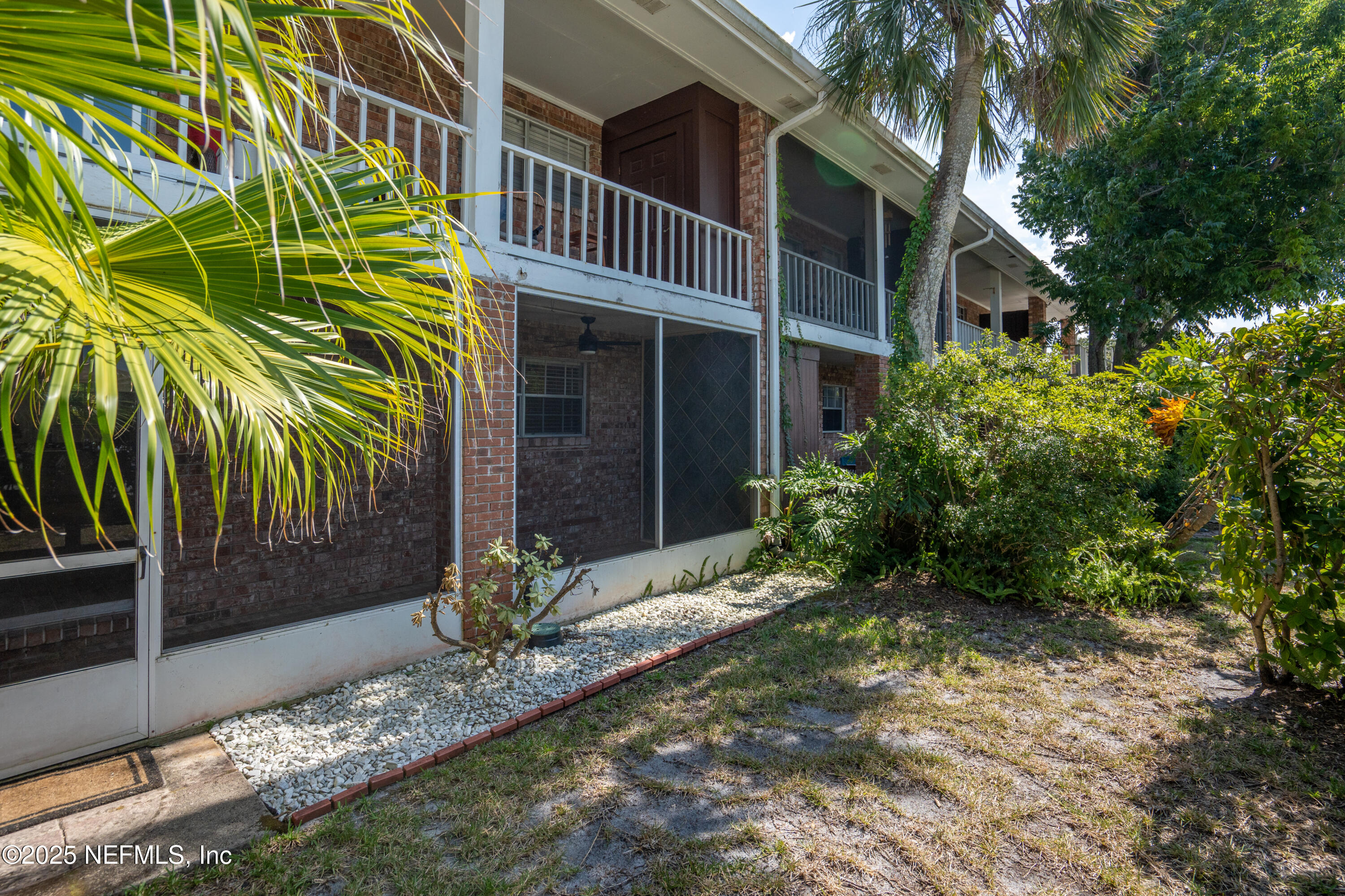 22 Comares Avenue, Unit 4A St. Augustine, FL 32080 - Photo 24 of 36 a view of a house with a yard