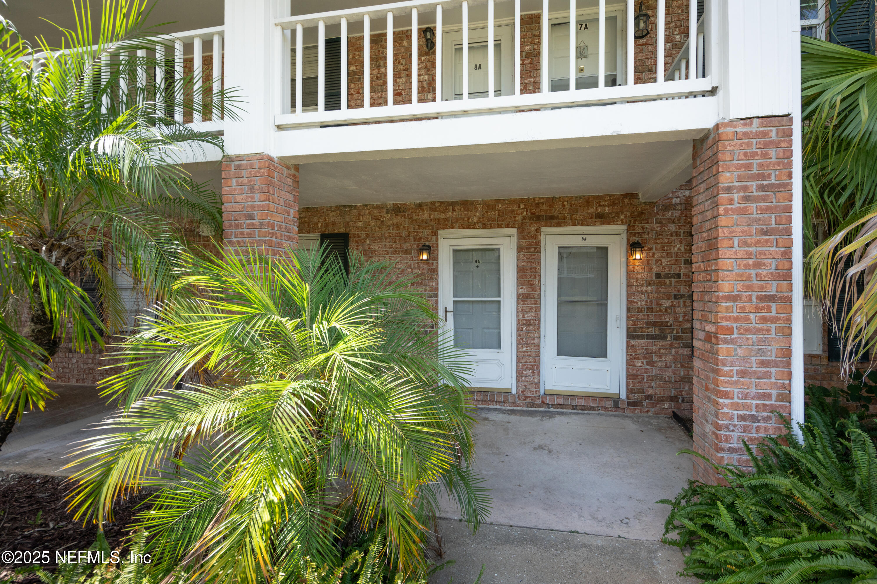 22 Comares Avenue, Unit 4A St. Augustine, FL 32080 - Photo 26 of 36 a front view of a house having yard