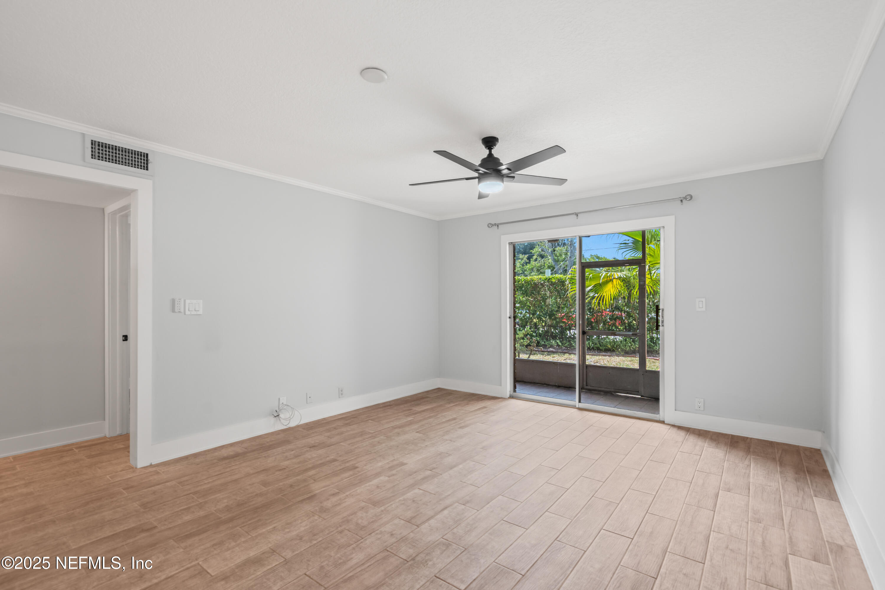 22 Comares Avenue, Unit 4A St. Augustine, FL 32080 - Photo 8 of 36 a view of an empty room with a window