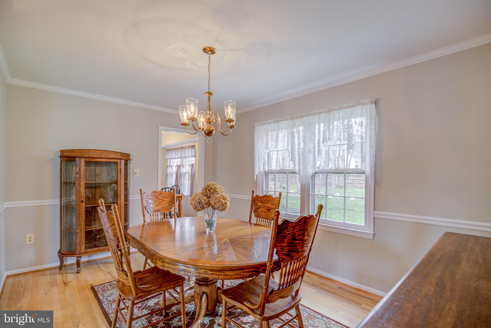 8921 Renshaw Court Springfield, VA 22153 - Photo 22 of 42 dining room with crown molding and chair rail